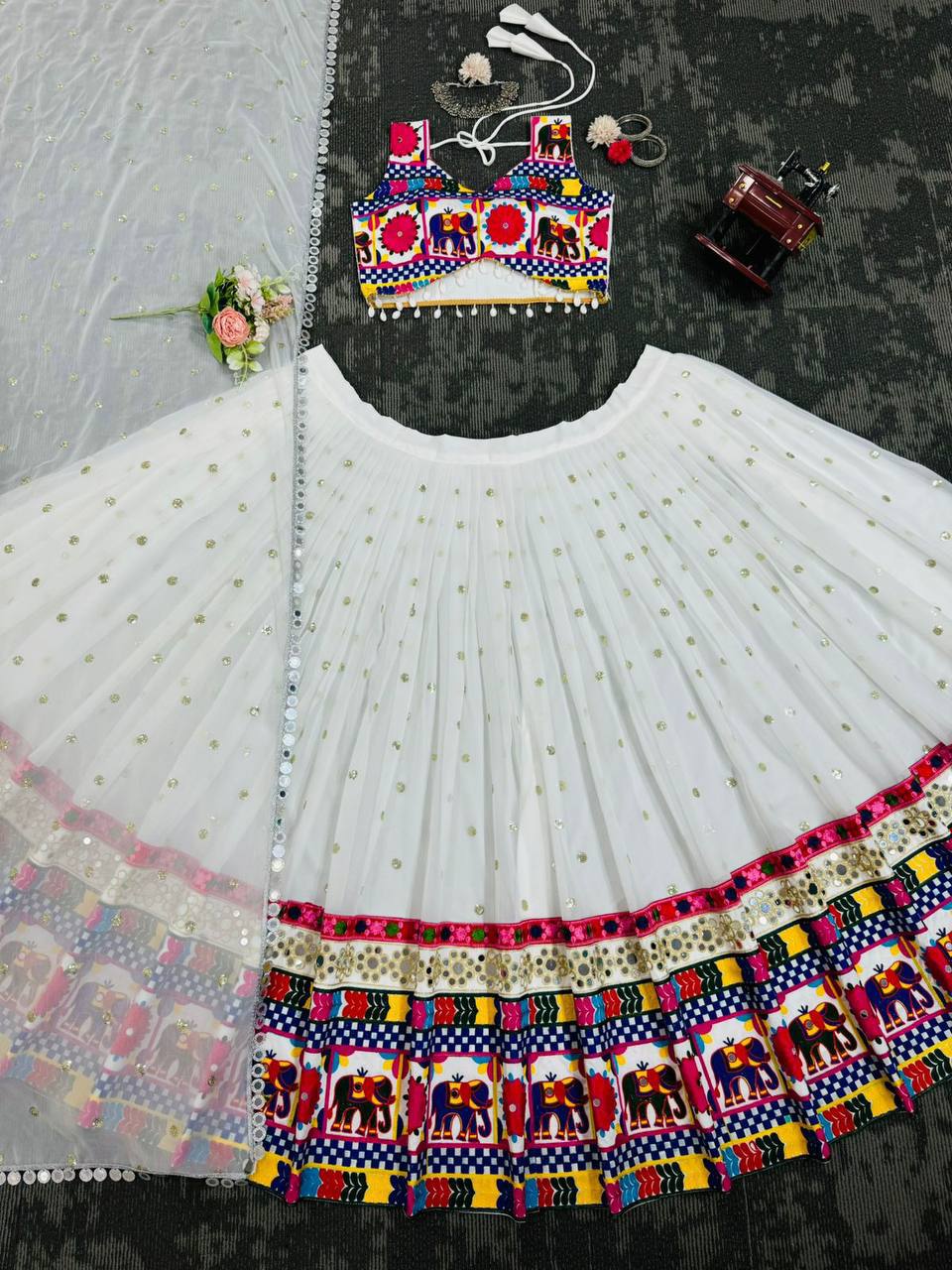 Exquisite Pristine White Designer Lehenga Choli with Vibrant Multicolored Traditional Elephant Embroidery and Mirror Work Detailing